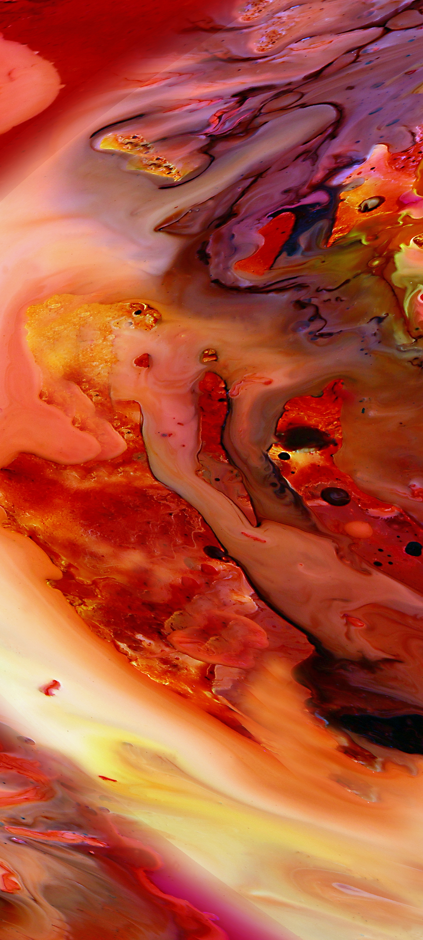 Flowing, red, black and yellow inks making the image other worldly.